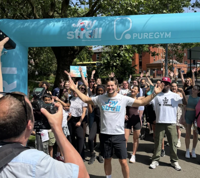 people cross the finish line at a PureGym race